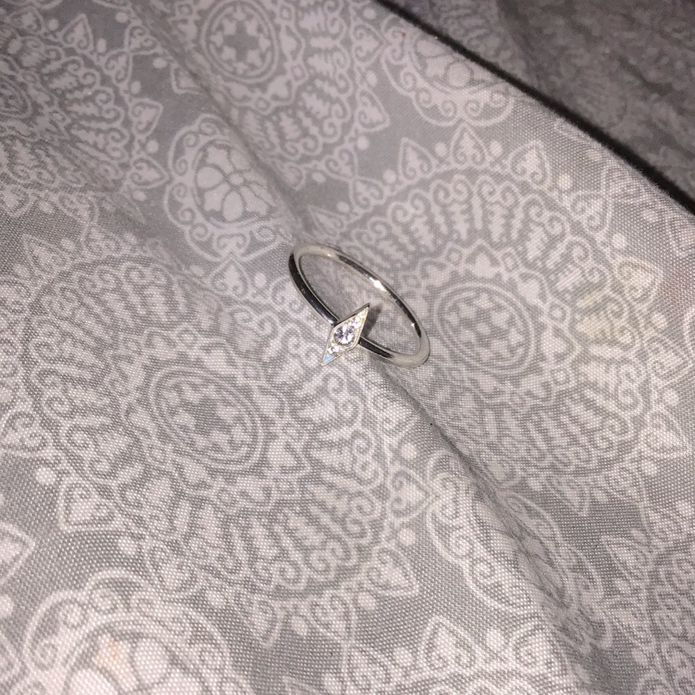 I am selling a silver diamond shaped diamond ring